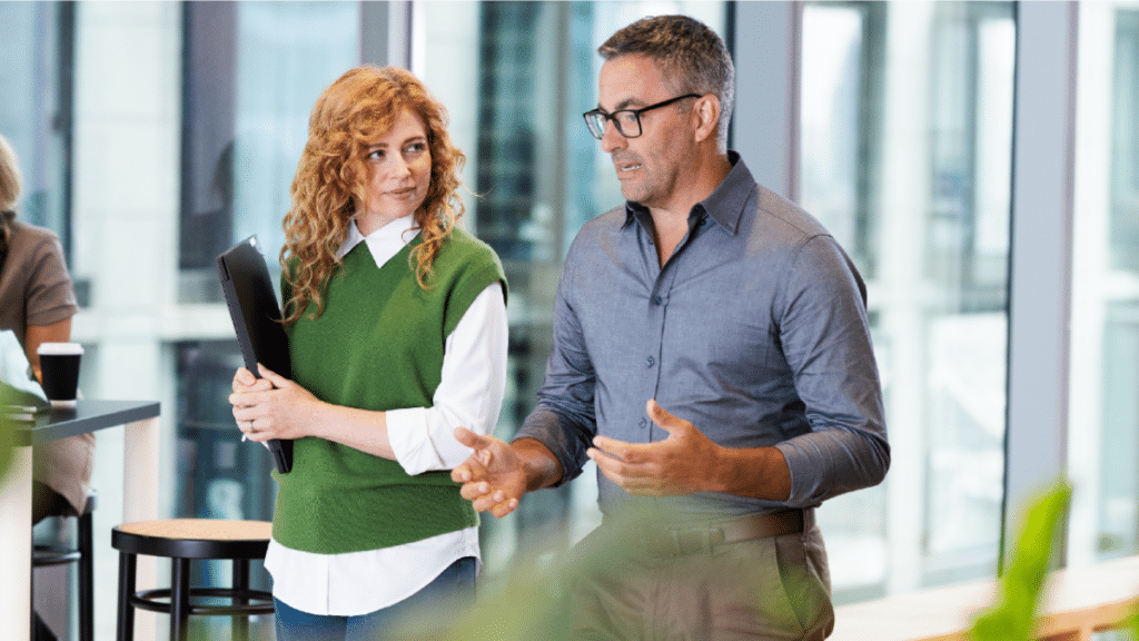 office meeting UKG discussing artificial intelligence talent strategies