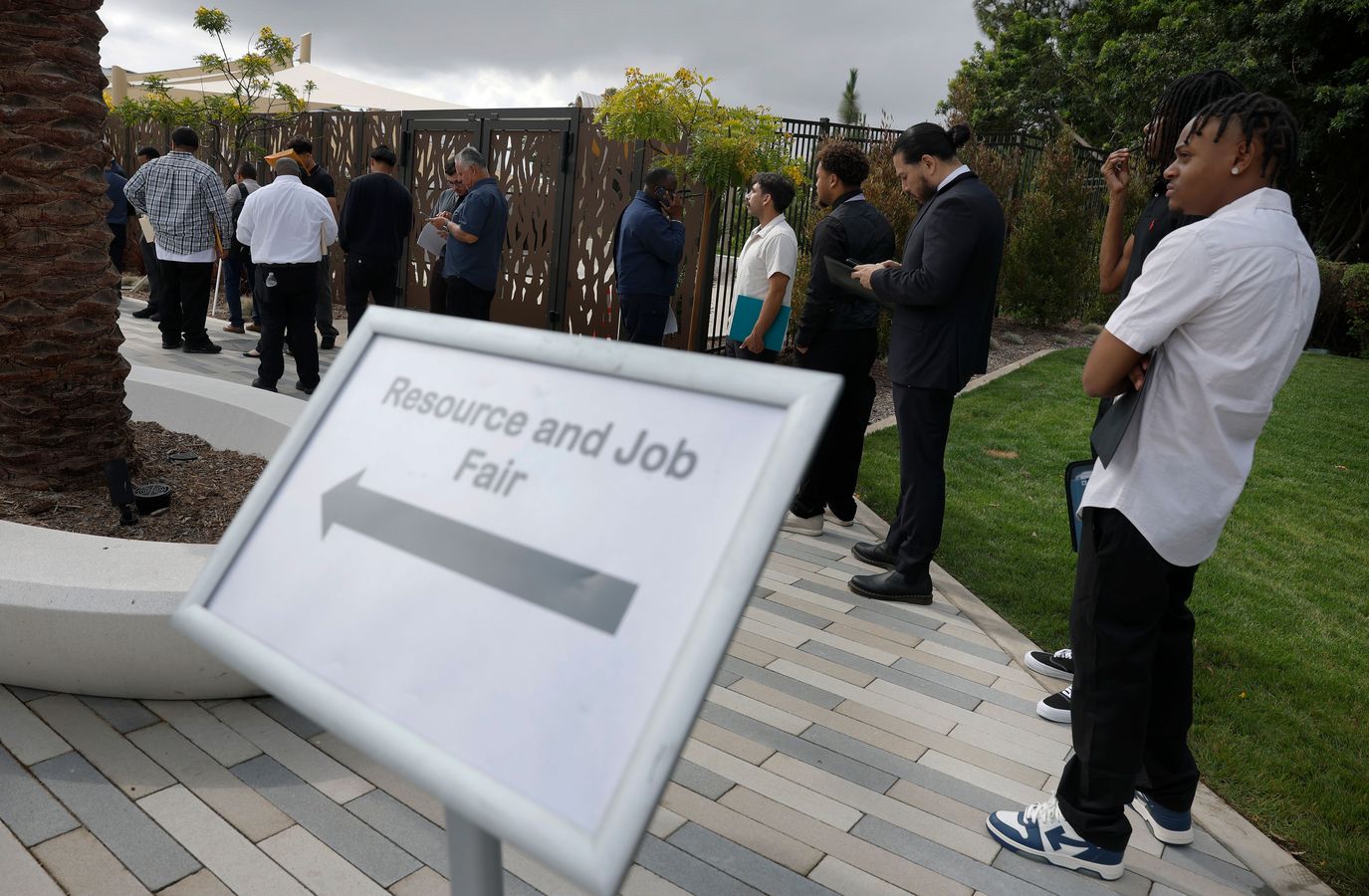 Job seekers stand in line at a job fair in Carson, California on June 30 2026.
