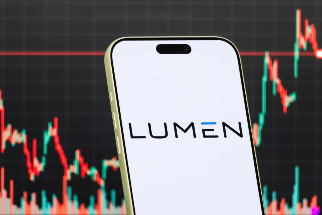 Lumen logo is displayed on a phone against a screen depicting stock values.