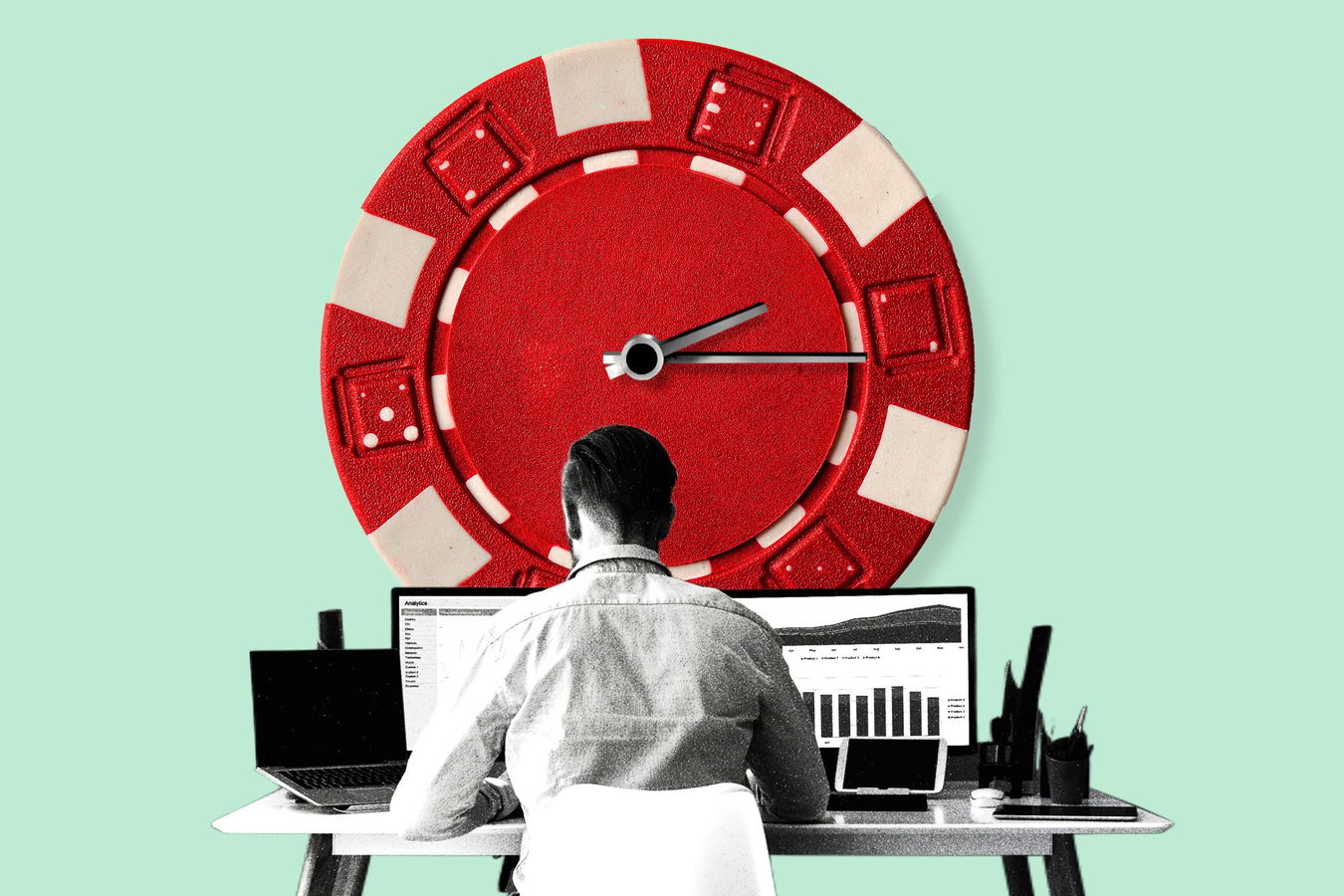 a man working at a desk with a gambling chip above