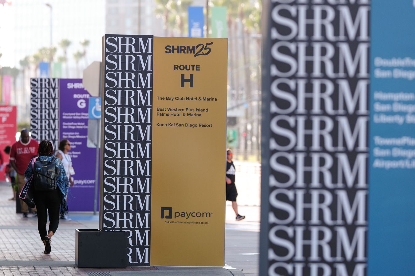 Attendees at SHRM's 2025 annual conference walk outside the San Diego Convention Center.